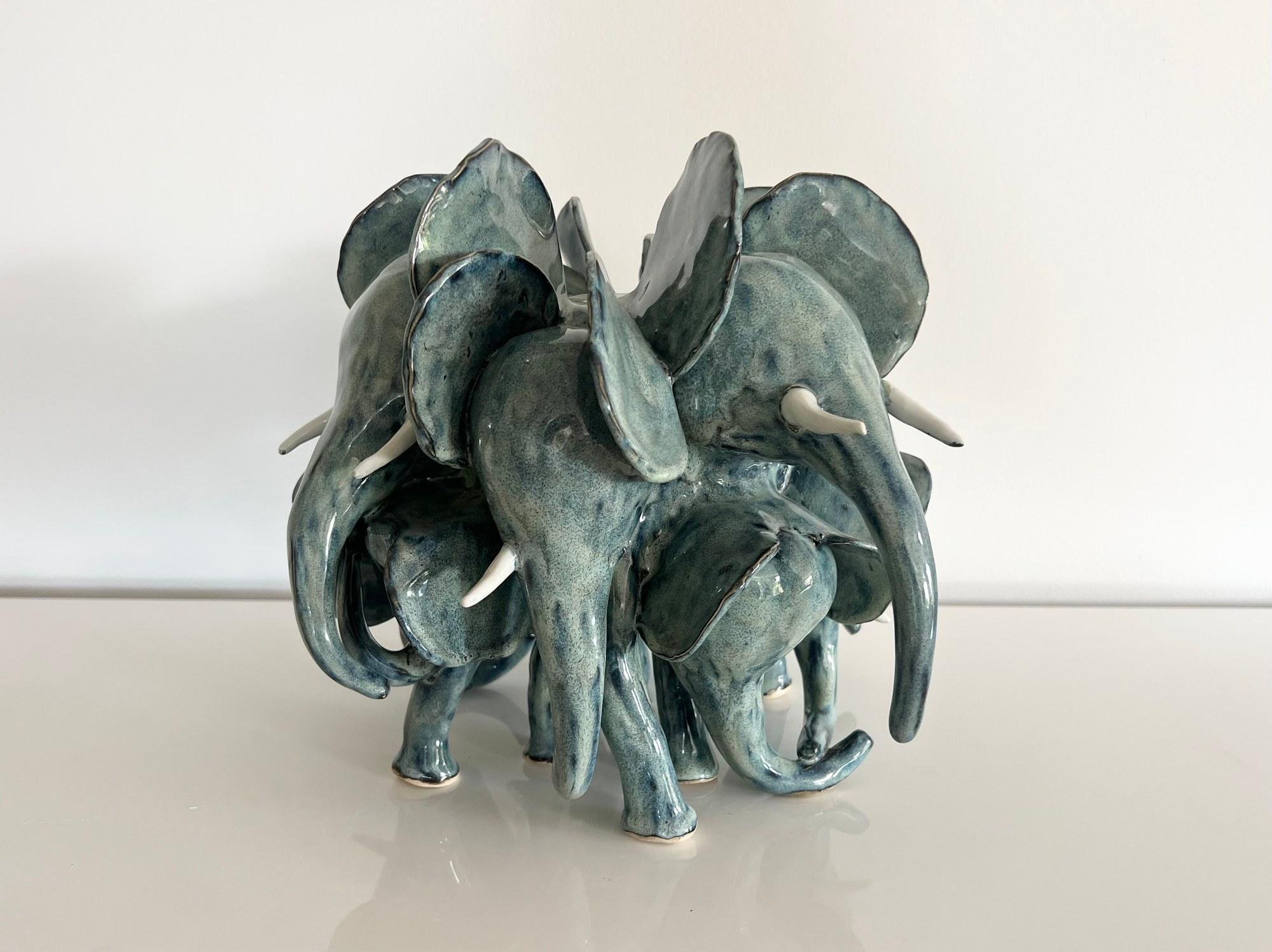 Sea green elephant herd seen from the side