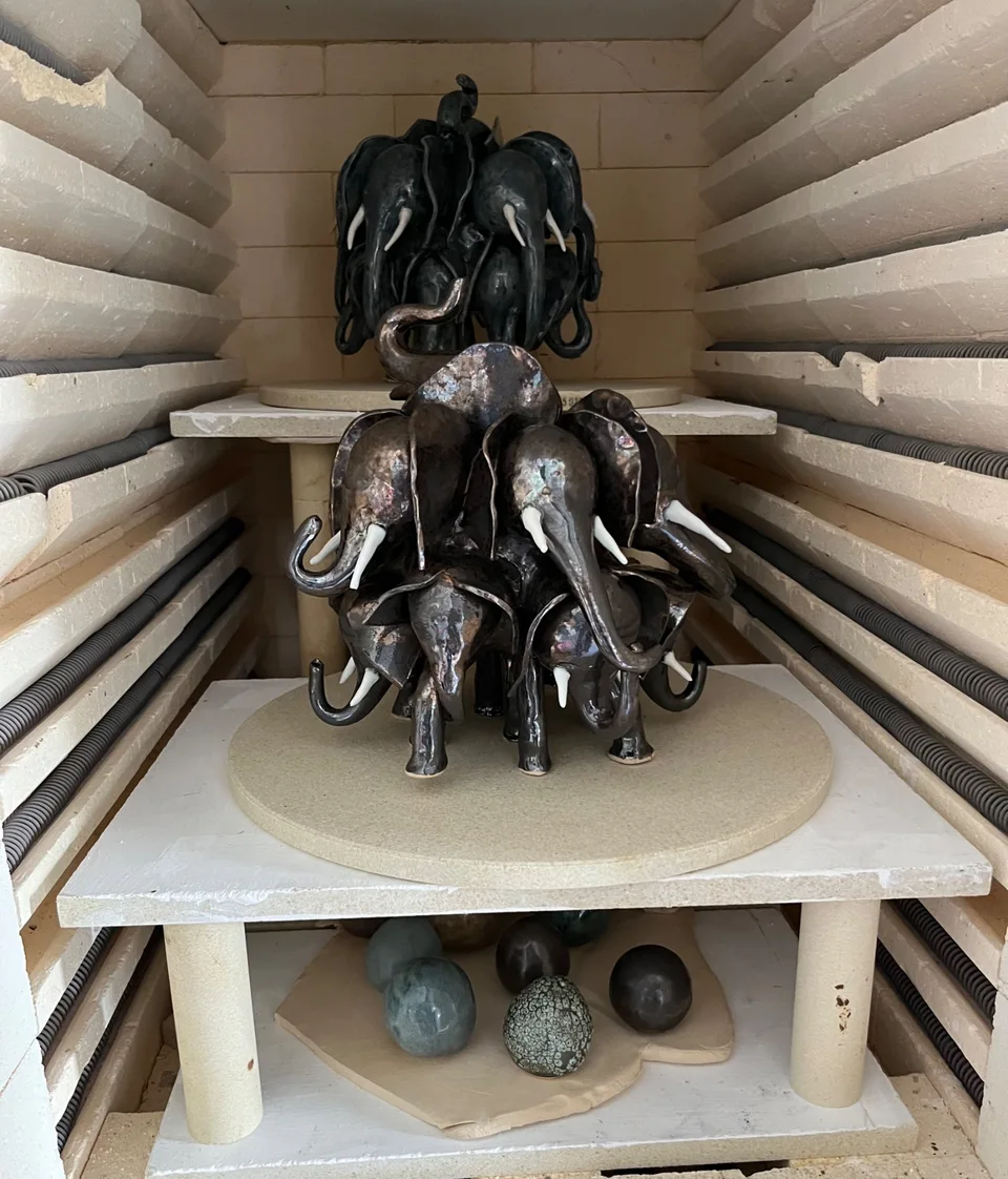 2 herds of elephants in a kiln after recent firing