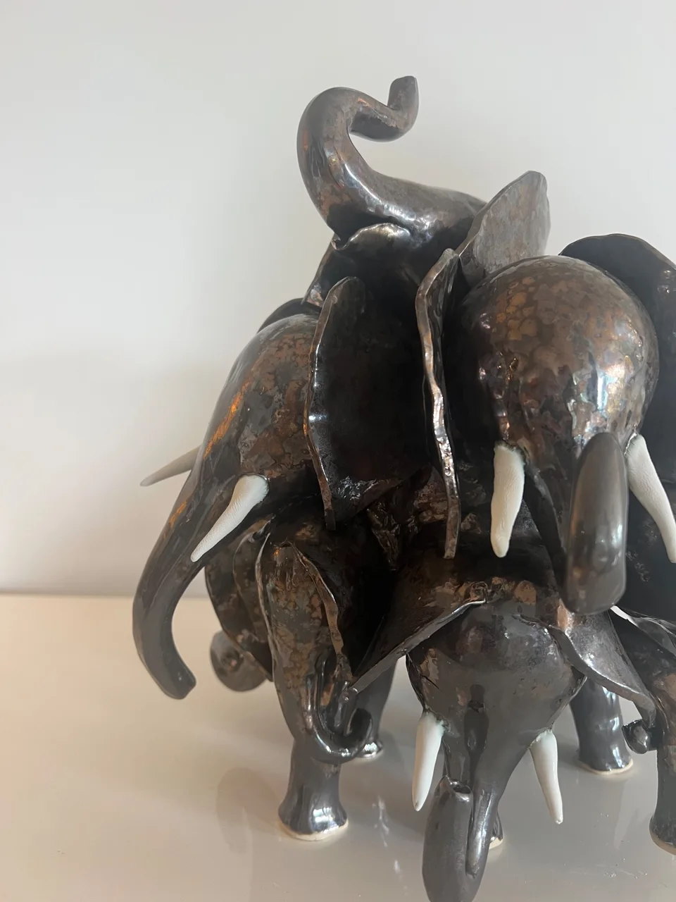 Close up of trumpeting elephant in vintage gold glaze