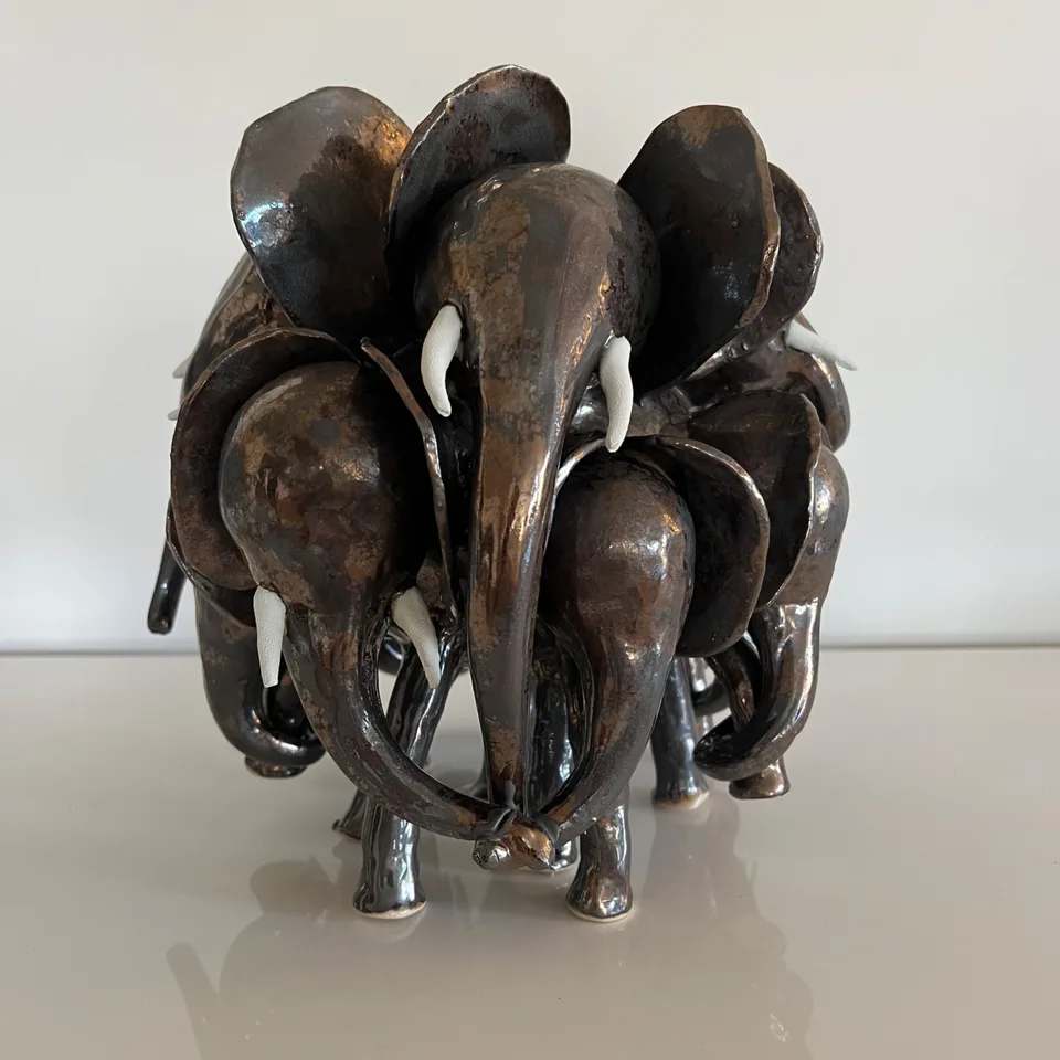 Closeup of mother elephant and twins